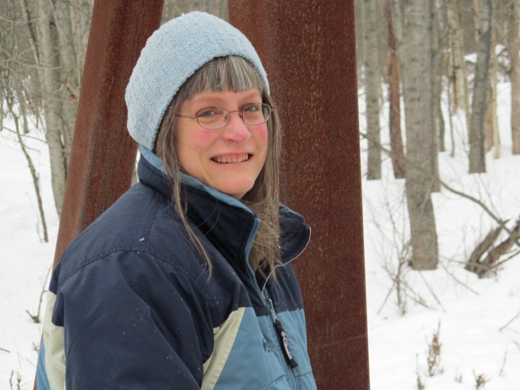 photo of the writer in winter wearing a coat and hat
