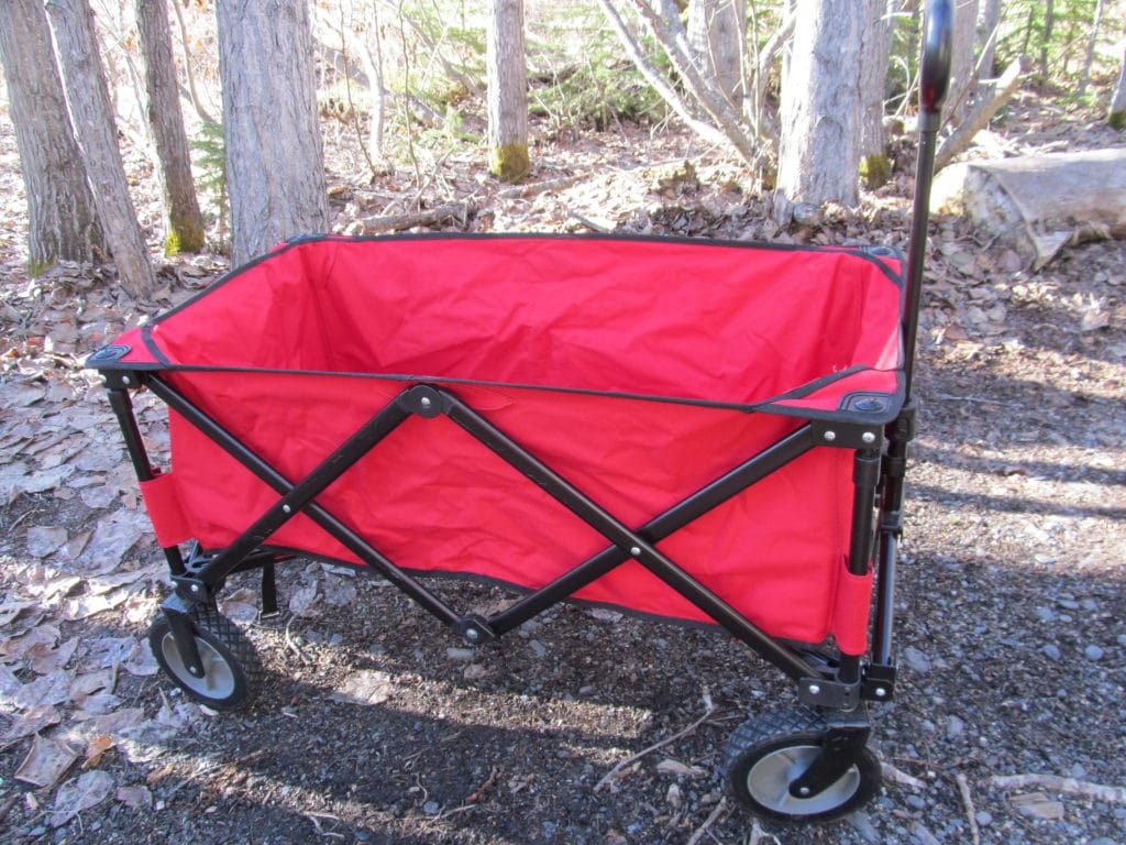 fold-up wagon made of strong canvas on a metal frame that folds up for easy transport.