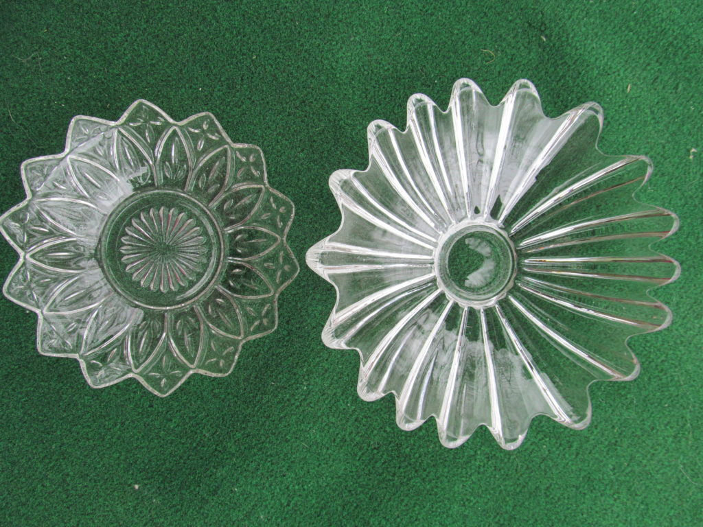 plate flowers 2 clear glass bowls that have a flower shaped edge