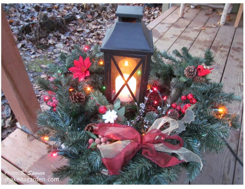 Christmas decor at the thrift store pine garland used to make this pretty Christmas basket display on the front porch