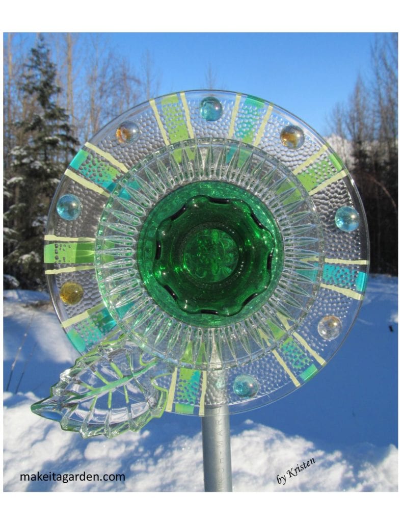 Sell your dish flower. Photo of a sparkly green all glass dish flower taken outside in the winter