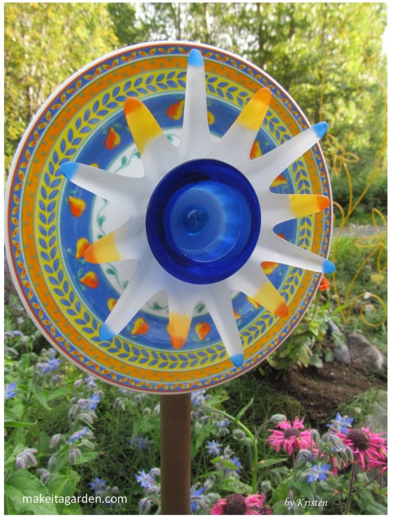 sell your dish flower. Photo of a vivid brightly colorful dish flower garden art displayed in thee garden