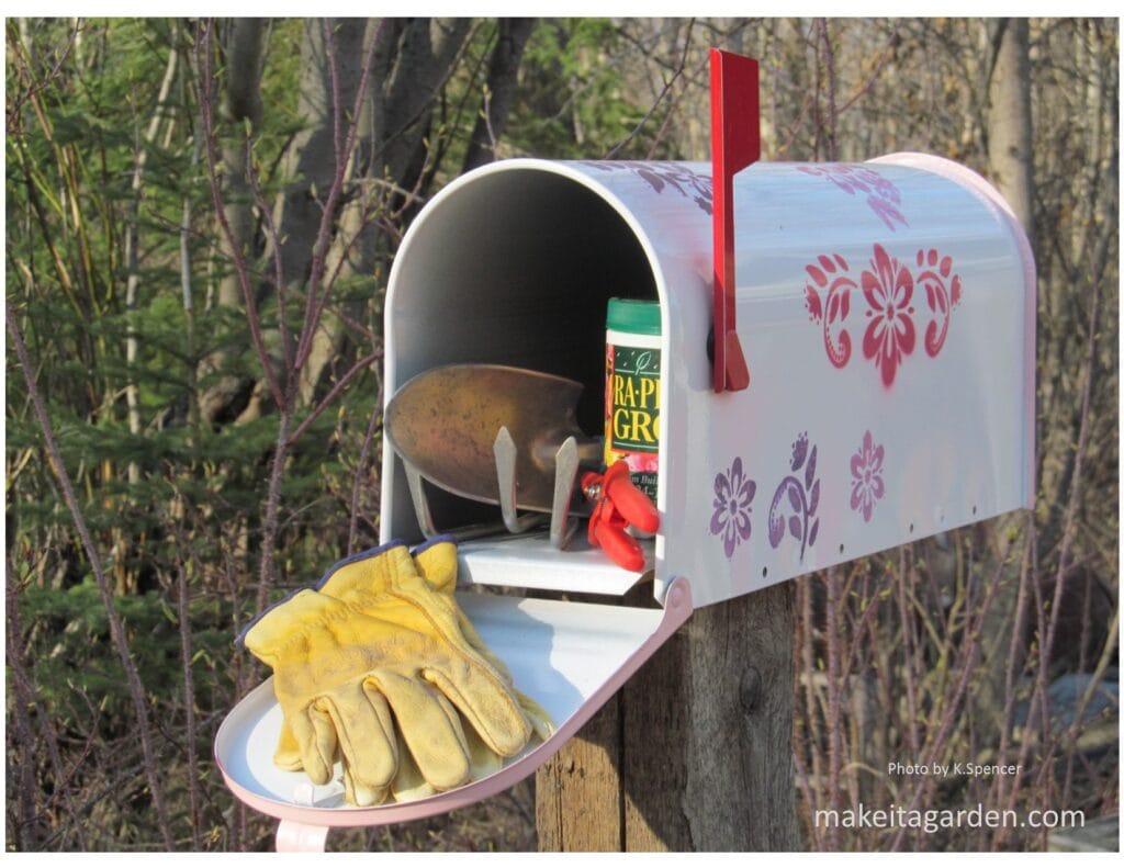 Mailbox with flowers on it turned into a small storage space for garden tools. Country Cottage Garden Ideas