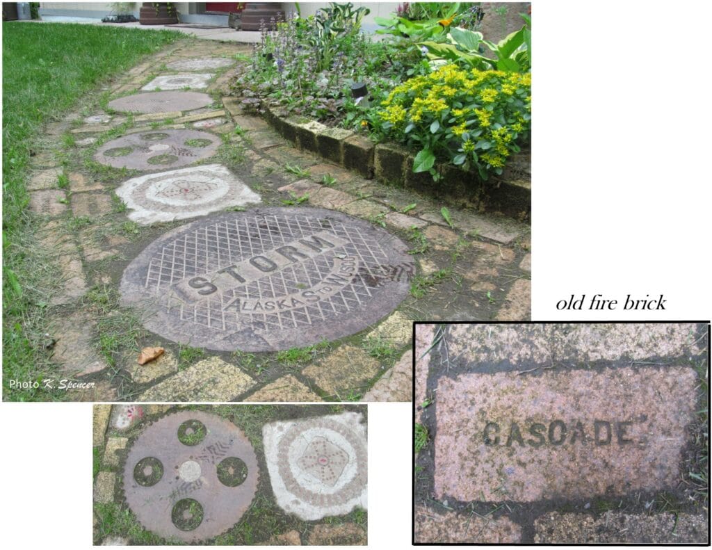 Image of storm drain (manhole) covers used to make a pathway. Imaginative sculptures make Palmer garden