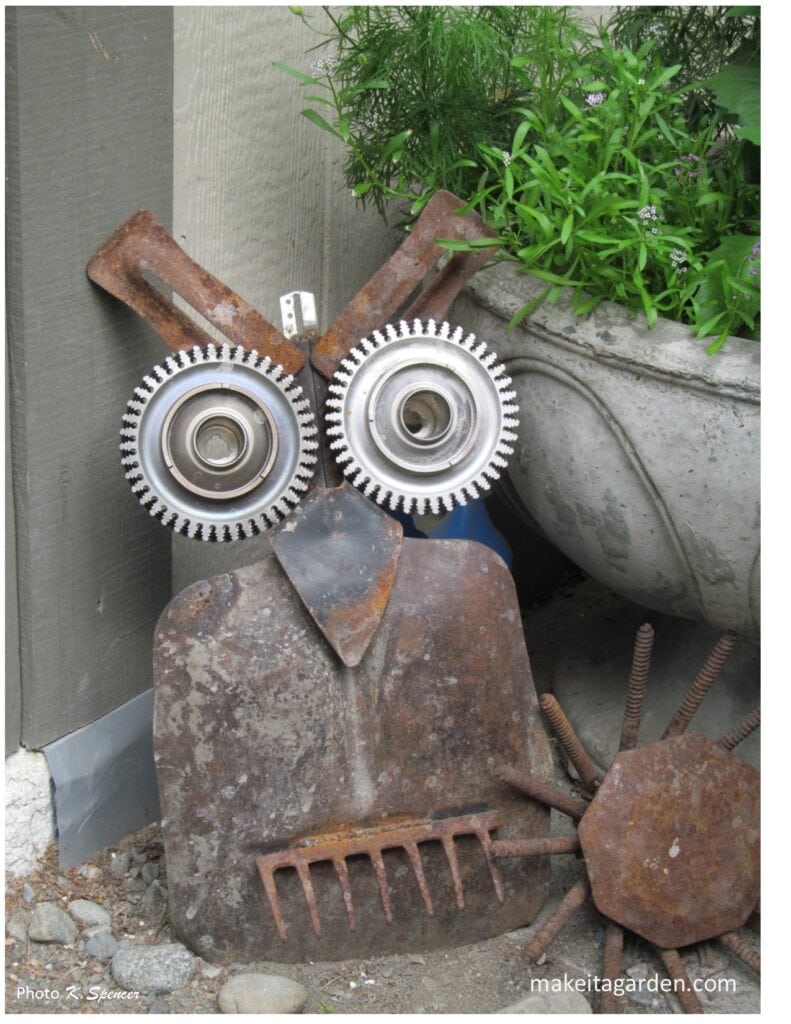Metal owl. Homemade yard art made from rusty farm junk.