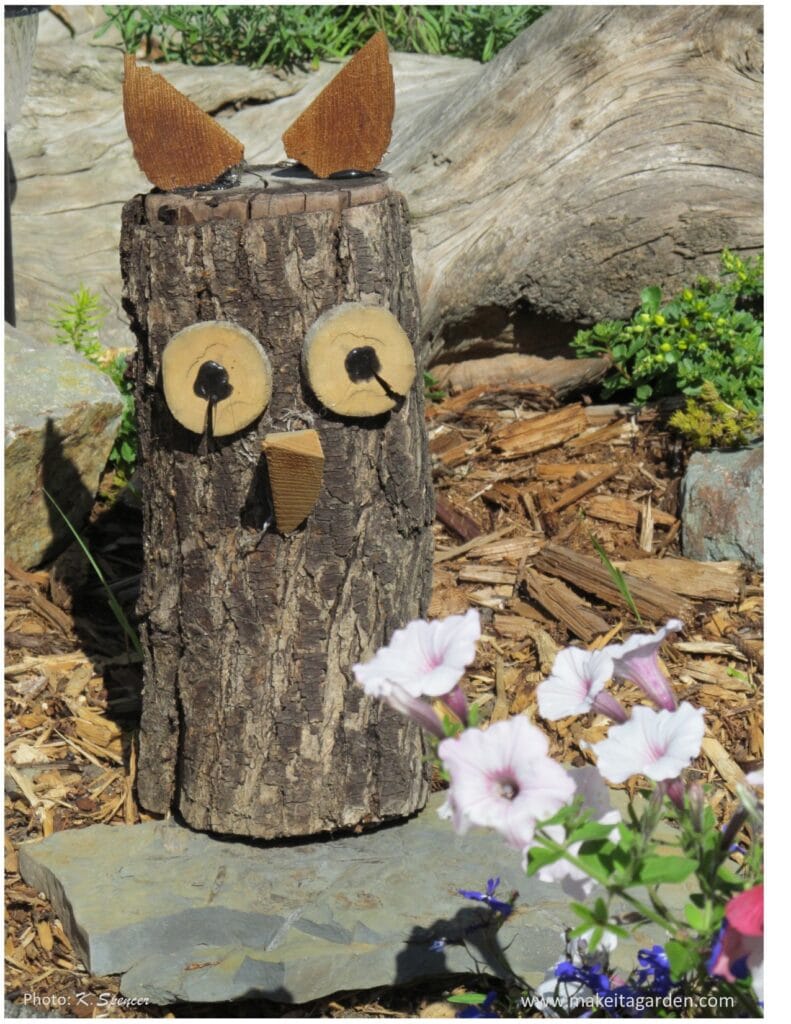 Log art. Log turned into an owl with wood rounds for eyes and a piece of wood for a beak and two small pieces of wood for  the ears