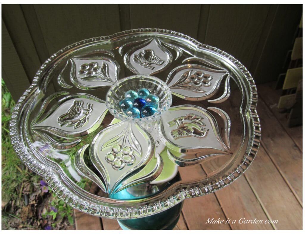 Close up photo of glass platter table top. Re-purpose a glass platter