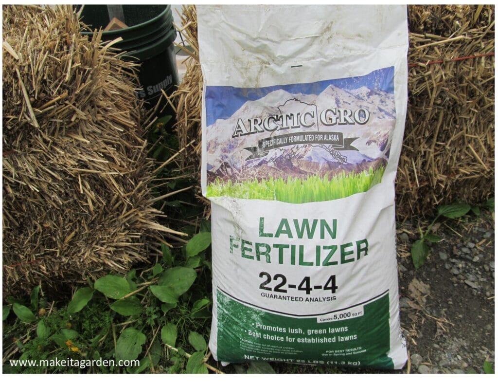 bag of lawn fertilizer to prepare the bales for planting 