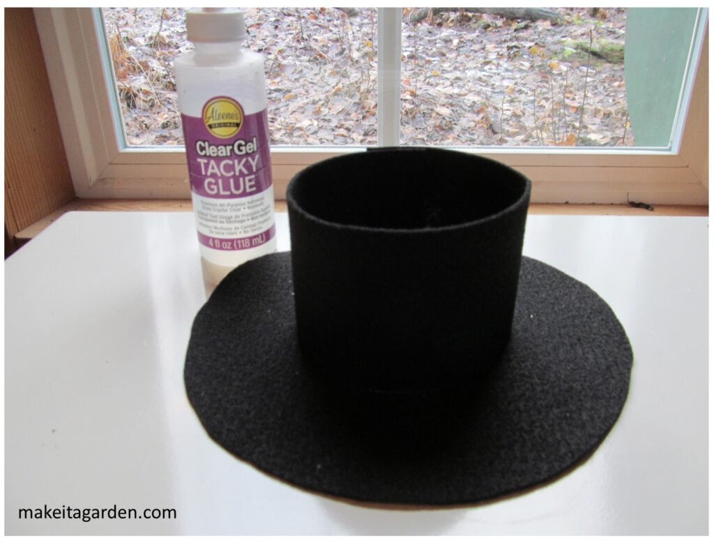 two pieces of the hat glued together, the vertical one on top of the brim piece.