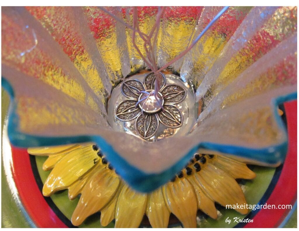 new dish flower design with the slider jewelry piece glued to the bottom of a dish, holding the wires upright.