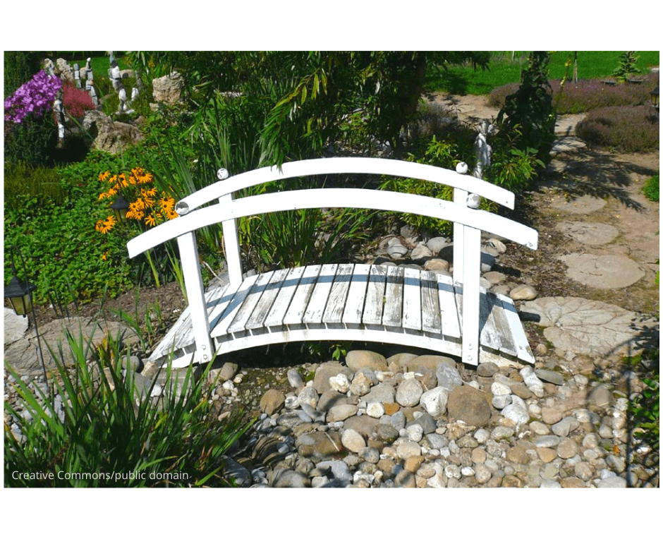 garden path ideas like this little white wooden bridge over a culvert in the garden