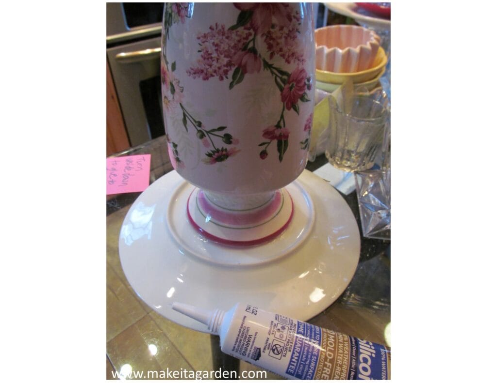 upside-down vase being glued to bottom of a plate