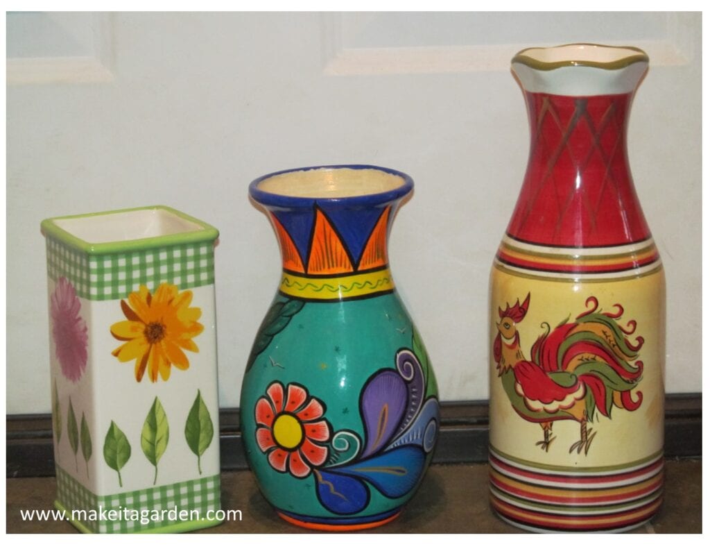3 vases used in making garden totems that have bright colors and decorative patterns