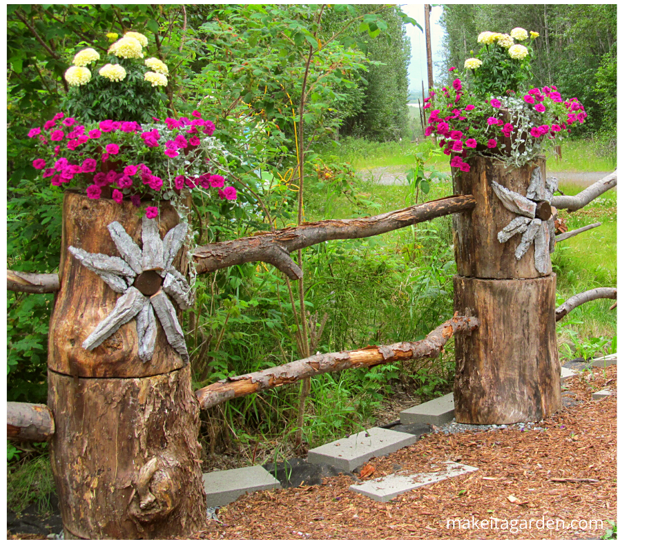 baskets and planters sit atop logs on a log fence