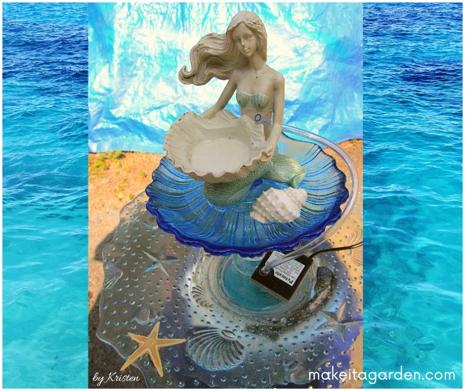 The little mermaid fountain all finished and photographed against an ocean backdrop