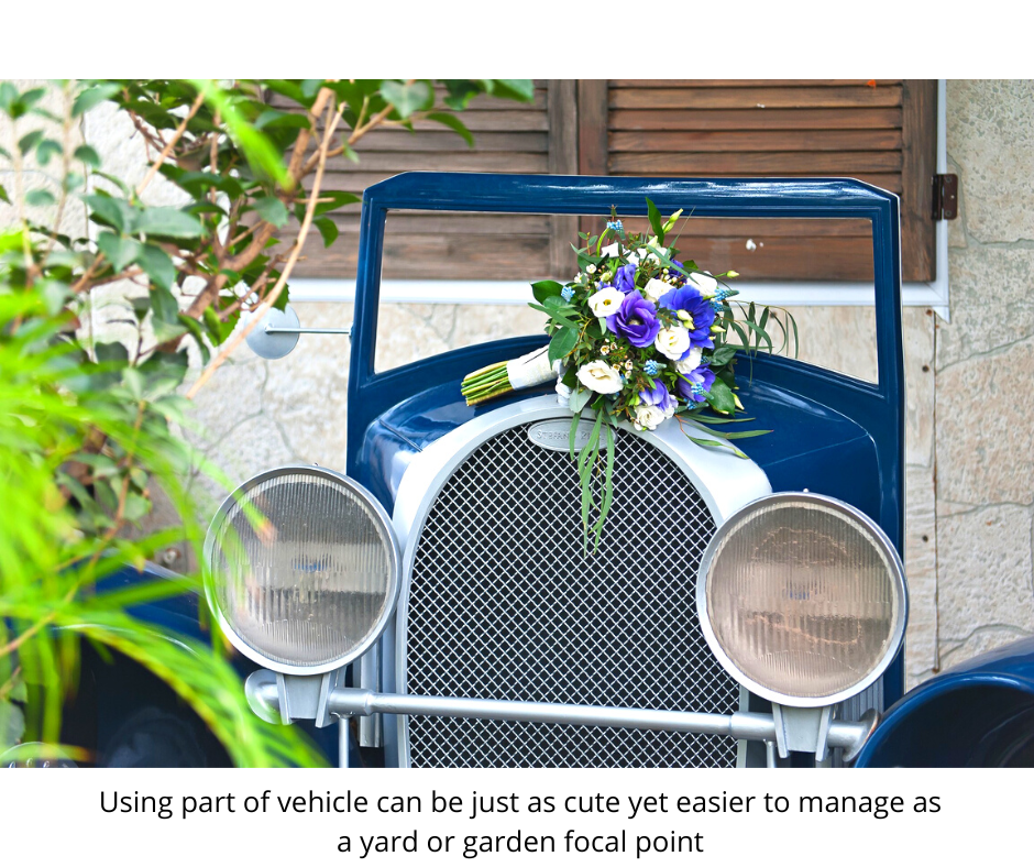 only the front of an early 1900's automobile is used as garden decor. Shows hood, headlights, and windshield.
